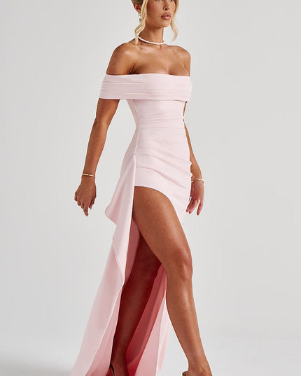 Side view of light pink maxi dress with off shoulder top, ruched detail, and flowing panel