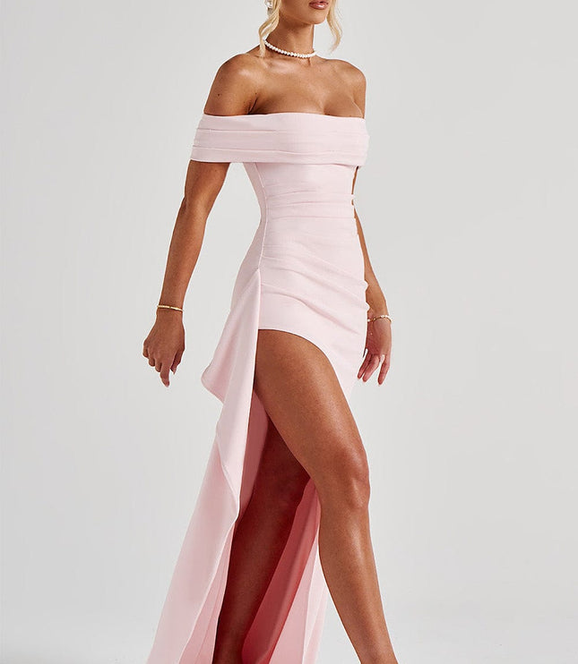Side view of light pink maxi dress with off shoulder top, ruched detail, and flowing panel
