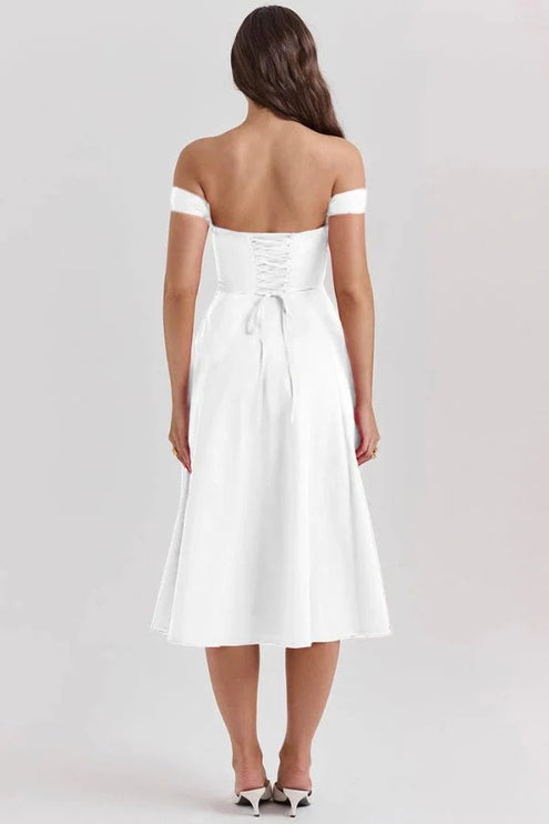Back view of white off shoulder midi dress with lace-up bodice and flowing midi skirt