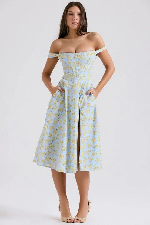 Front view of off shoulder midi dress in light blue with yellow floral print and slit