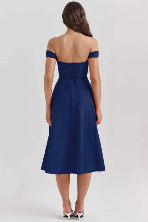 Back view of navy blue off shoulder midi dress with lace-up bodice and midi hemline