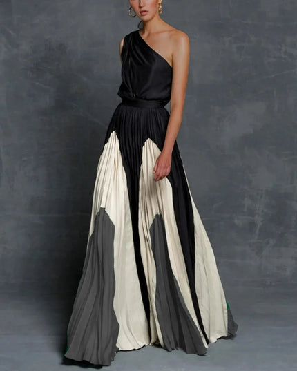 One-shoulder black maxi dress with pleated gray and cream color block skirt