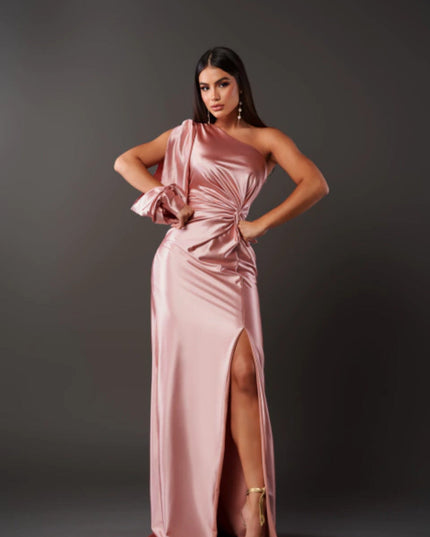 Blush pink one shoulder ruched maxi dress with side slit and draped sleeve detail