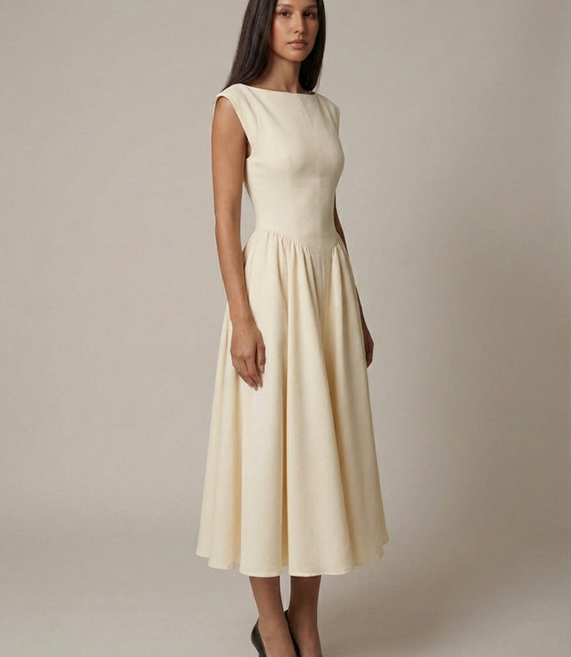 Side view of cream sleeveless midi dress with cinched waist and flared skirt, formal dress