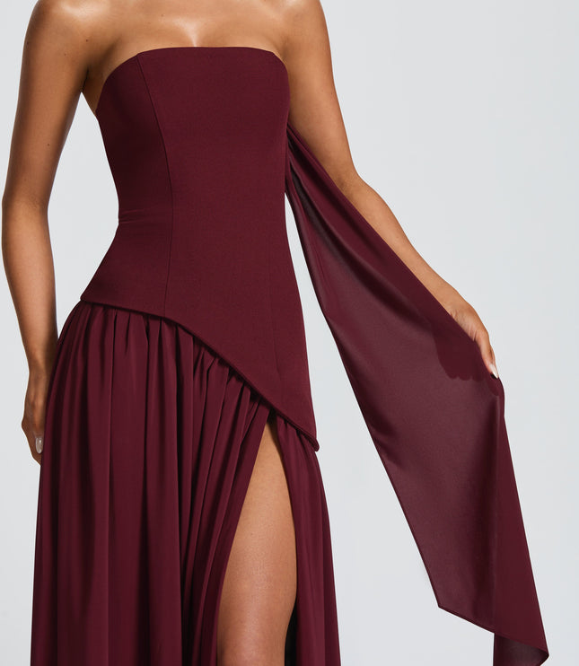 Close-up of burgundy strapless corset bodice with draped fabric detail