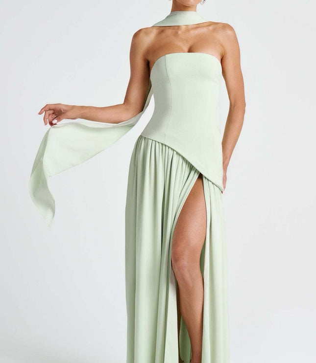 Sage green strapless formal dress with flowing draped fabric and asymmetrical hem