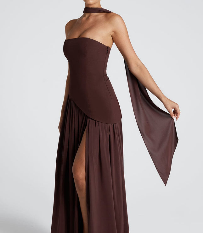 Side view of brown formal maxi dress with draped fabric and leg slit detail