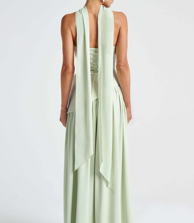 Back view of mint strapless formal dress with flowing skirt