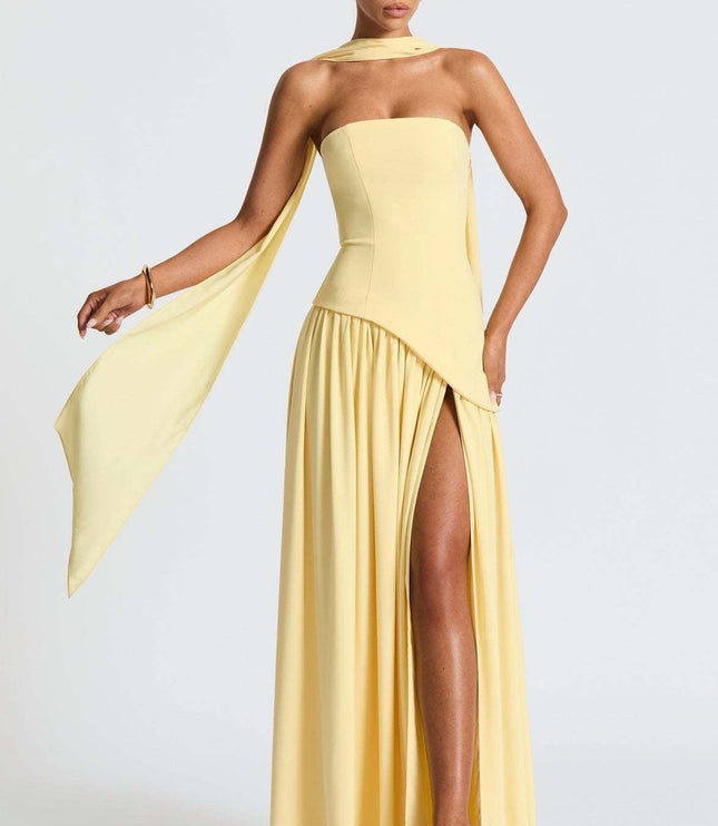 Pale yellow strapless maxi dress with high slit and shoulder wrap
