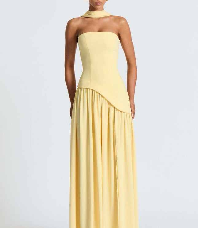 Front view of yellow formal strapless corset dress with pleated skirt