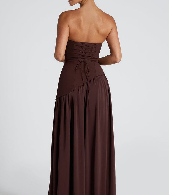 Back view of brown formal maxi dress showing ruched corset and draped fabric