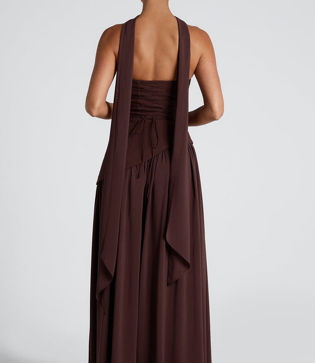 Back view of brown strapless maxi dress with tie-back waist and flowing hem