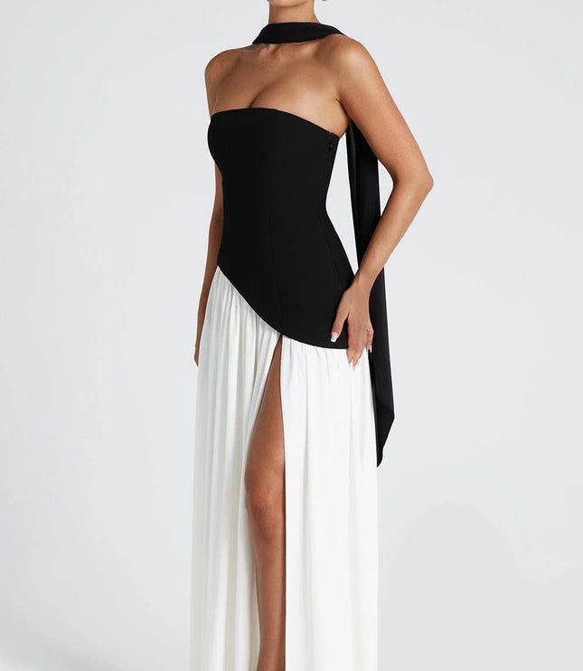 Black and white formal maxi dress with strapless corset bodice and draped skirt