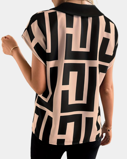 Back view of geometric v-neck top showing black and cream rectangular print design