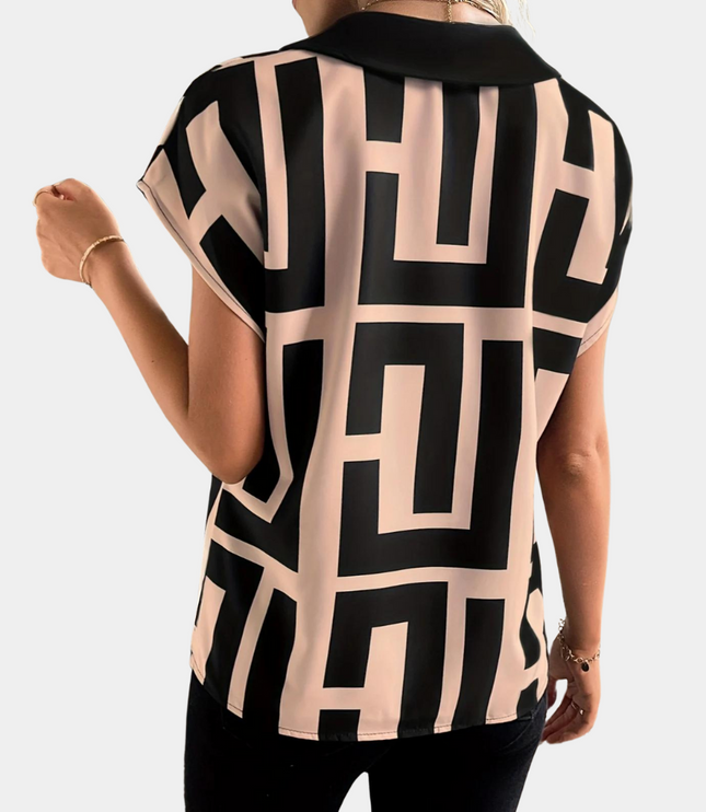 Back view of geometric v-neck top showing black and cream rectangular print design