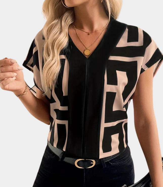Black and beige geometric v-neck short sleeve blouse with abstract block pattern
