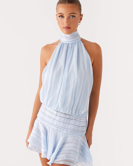 Light blue pleated halter mini dress front view with wrapped waist detail