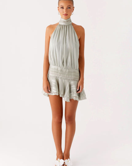 Sage green pleated halter mini dress with high neckline and flared skirt