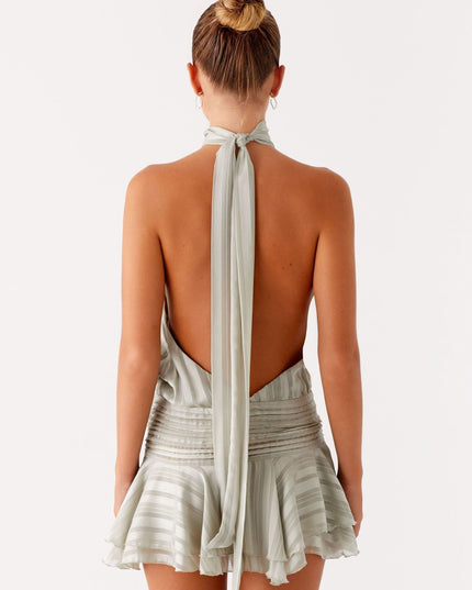 Sage green pleated halter mini dress with tied back closure and ruched waist