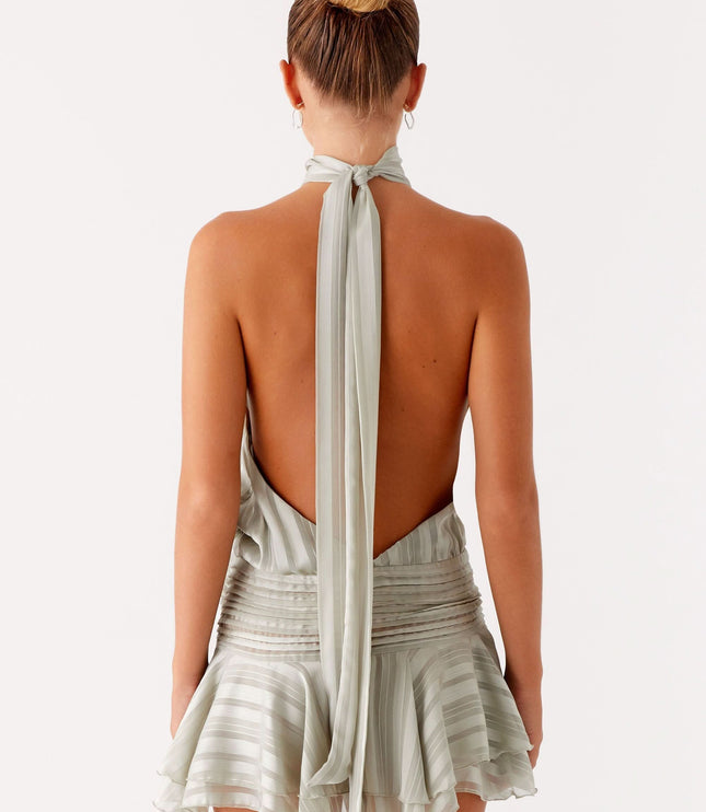 Sage green pleated halter mini dress with tied back closure and ruched waist