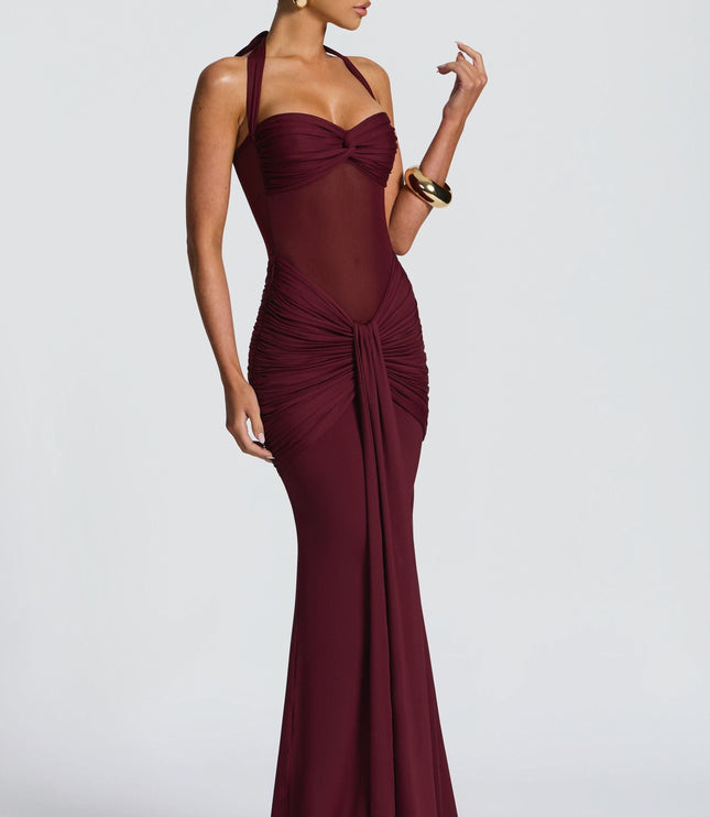 Burgundy halter maxi dress side view with ruched bodice and flowing skirt
