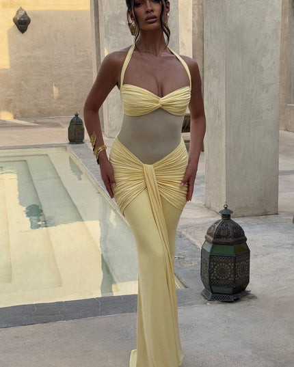 Yellow halter maxi sundress with ruched details poolside