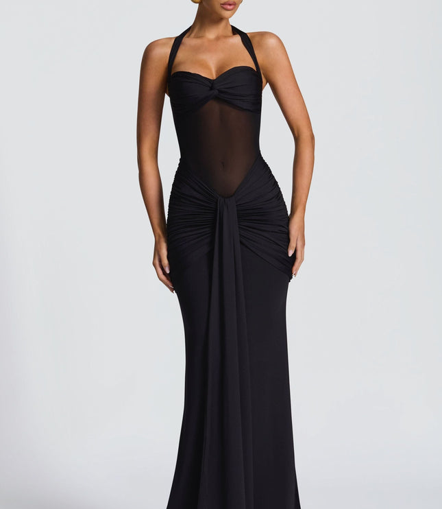 Black halter maxi dress with ruched bodice and sheer panel
