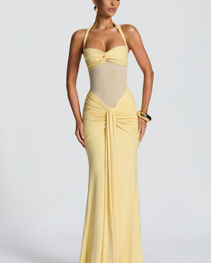 Yellow halter maxi dress with ruched bodice and twisted neckline