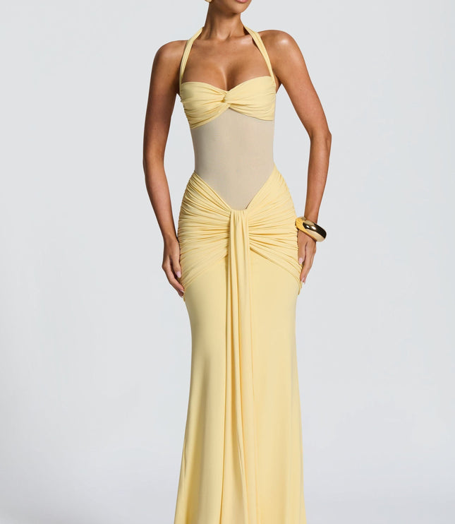 Yellow halter maxi dress with ruched bodice and twisted neckline