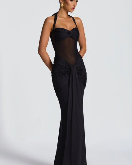 Side profile black halter sweetheart dress with ruched hip draping
