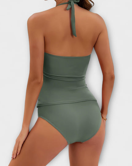 Back view of sage green halter swimsuit with tied neck closure