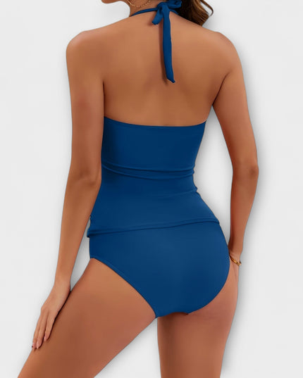 Back view of navy blue halter swimsuit with tied halter closure