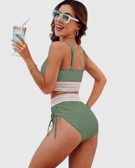 Green halter bikini with high-waisted bottoms and striped waistband detail