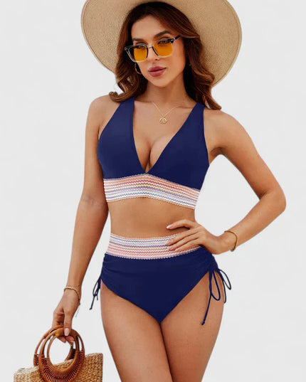 Navy blue high-waisted halter bikini with multicolor geometric stripe detail