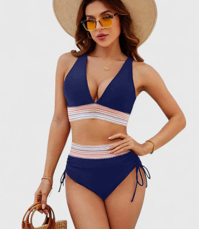 Navy blue high-waisted halter bikini with multicolor geometric stripe detail