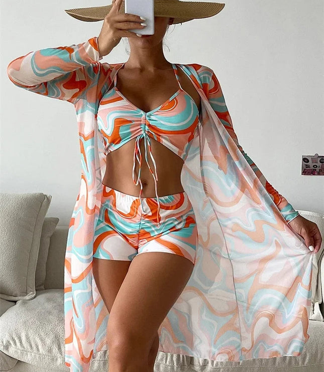 Orange and turquoise abstract print bikini set with high waist shorts and long sleeve cover-up