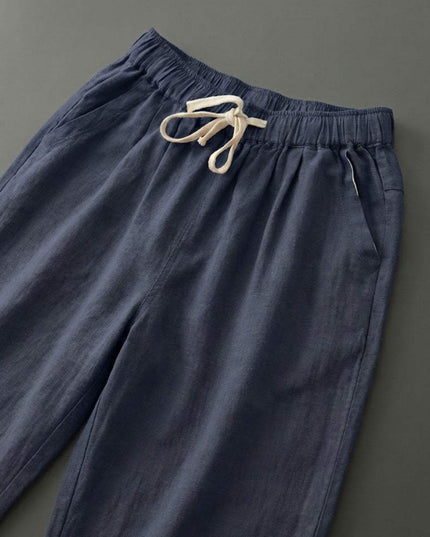 Navy linen drawstring pants with cream drawstring detail