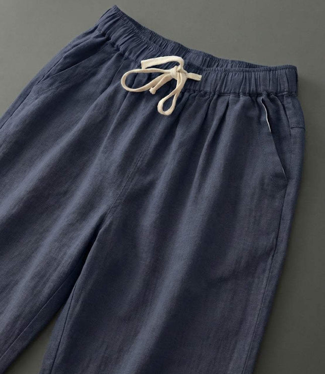 Navy linen drawstring pants with cream drawstring detail