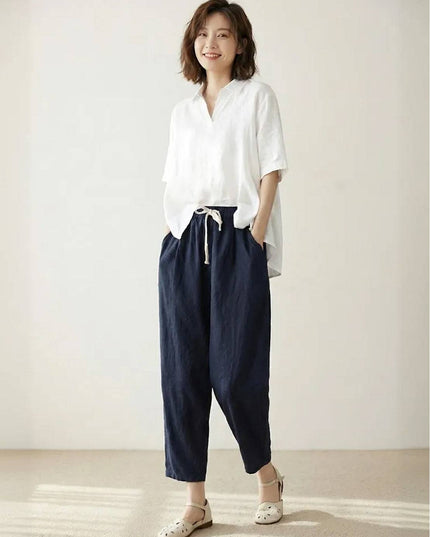 Navy linen drawstring pants with white button-up shirt, casual style