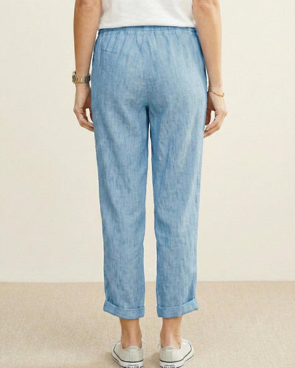 Back view of light blue linen casual pants with rolled cuffs