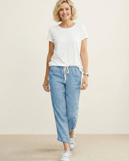 Full length light blue linen drawstring pants styled with white tee