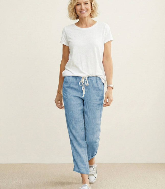 Full length light blue linen drawstring pants styled with white tee
