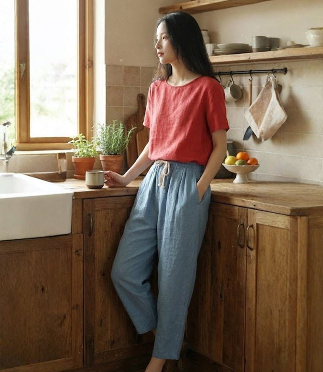 Slate blue linen pants with cream drawstring in kitchen setting