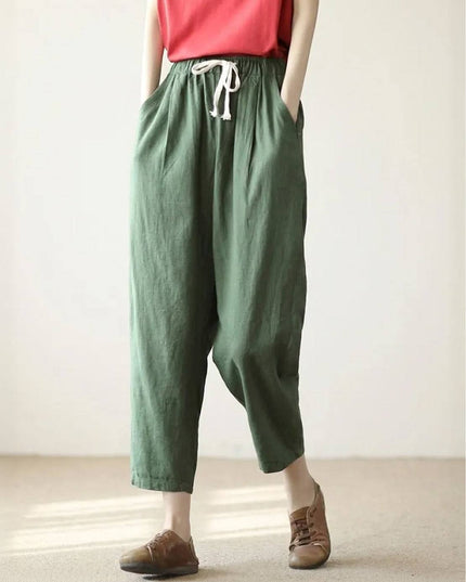 Sage green linen drawstring pants with relaxed fit silhouette