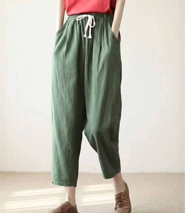 Sage green linen drawstring pants with relaxed fit silhouette