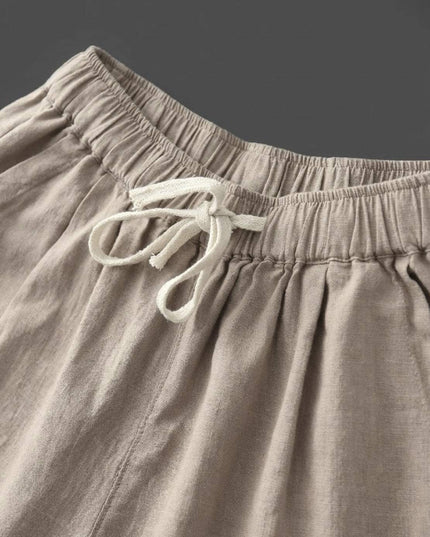 Close-up of cream drawstring waist detail on linen pants
