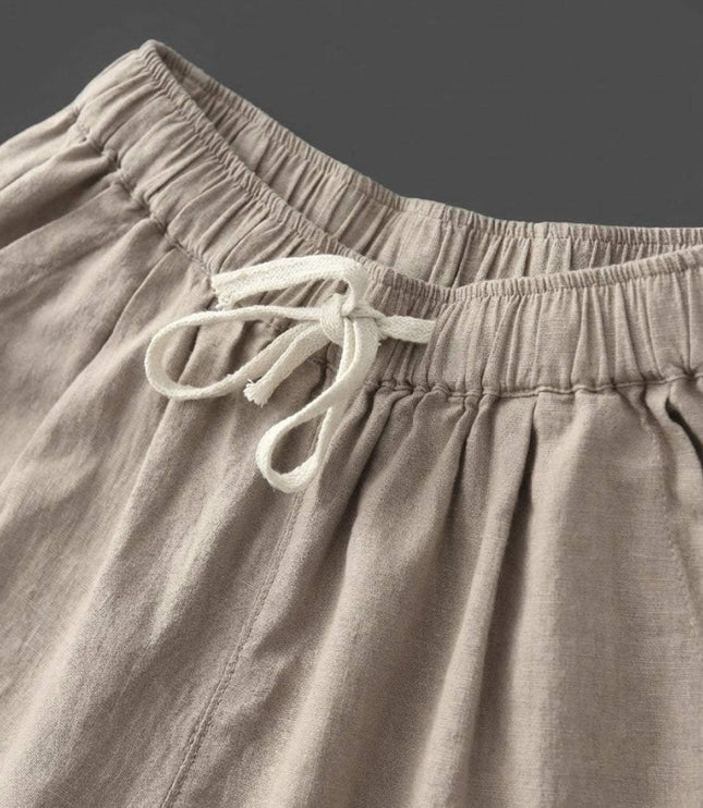 Close-up of cream drawstring waist detail on linen pants