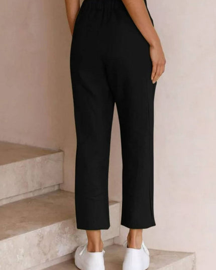 Back view of black linen casual pants with drawstring