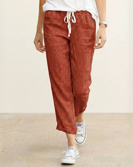Rust-colored linen drawstring pants with relaxed fit