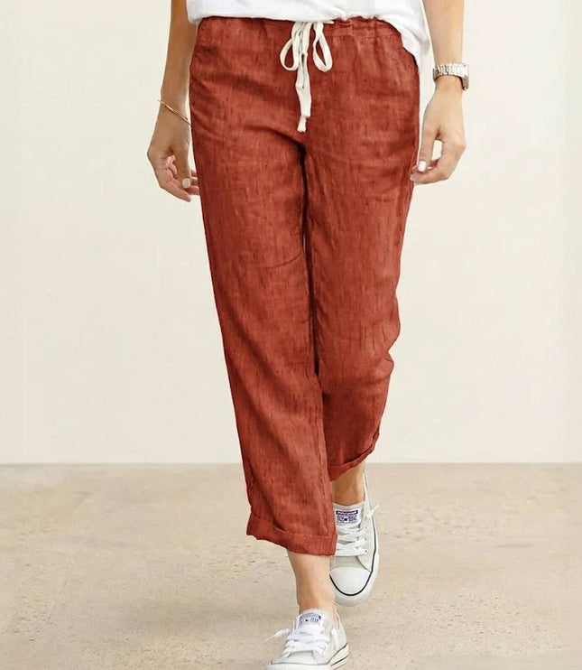 Rust-colored linen drawstring pants with relaxed fit